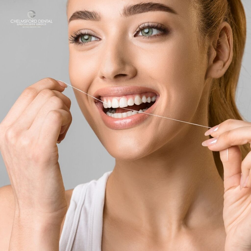 dental exam | patient flossing teeth | chelmsford dentist
