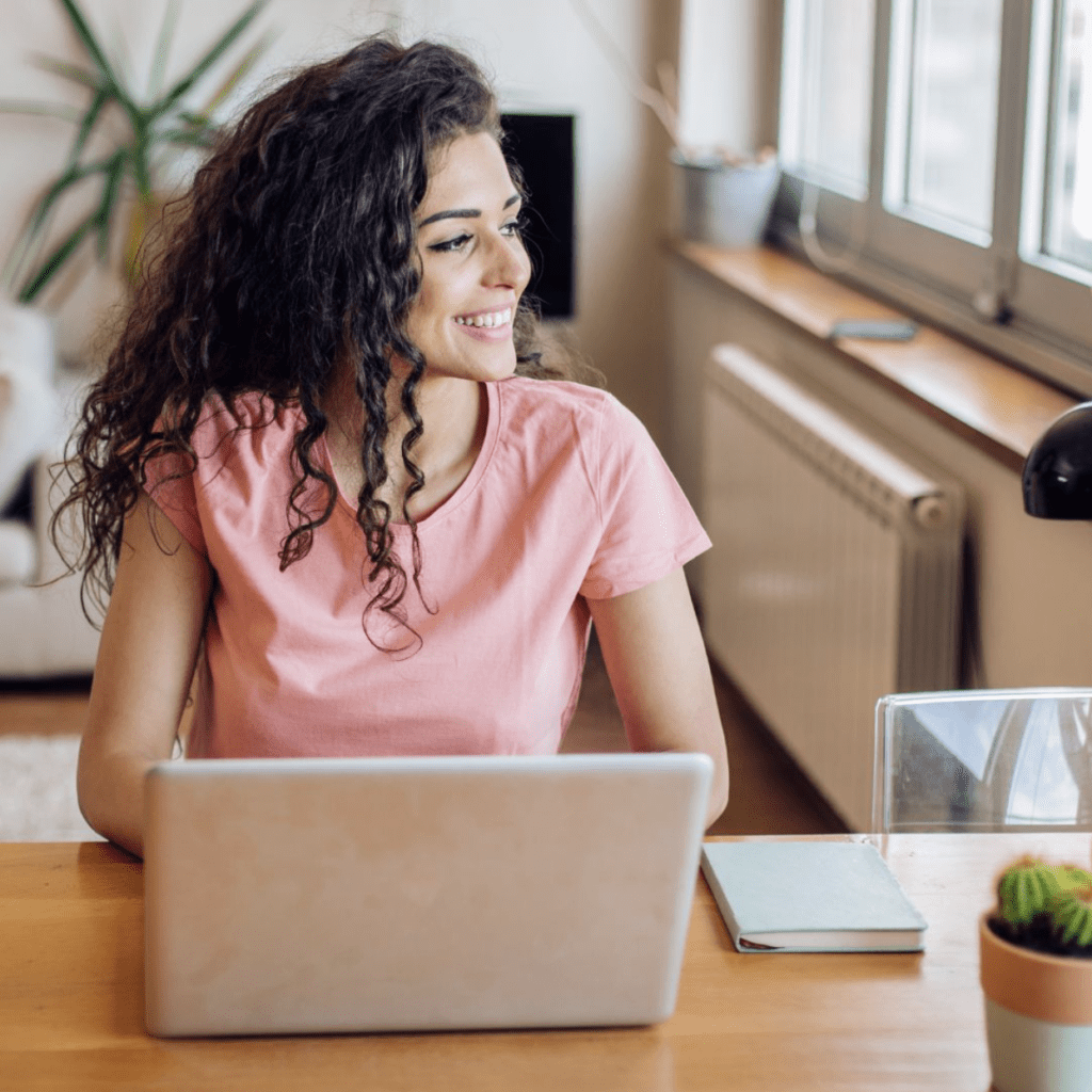 smiling woman with laptop