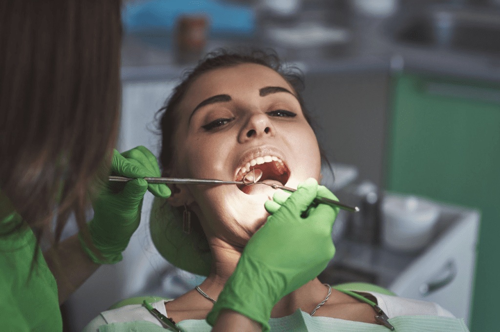 patient at the dentist undergoing dental checkup