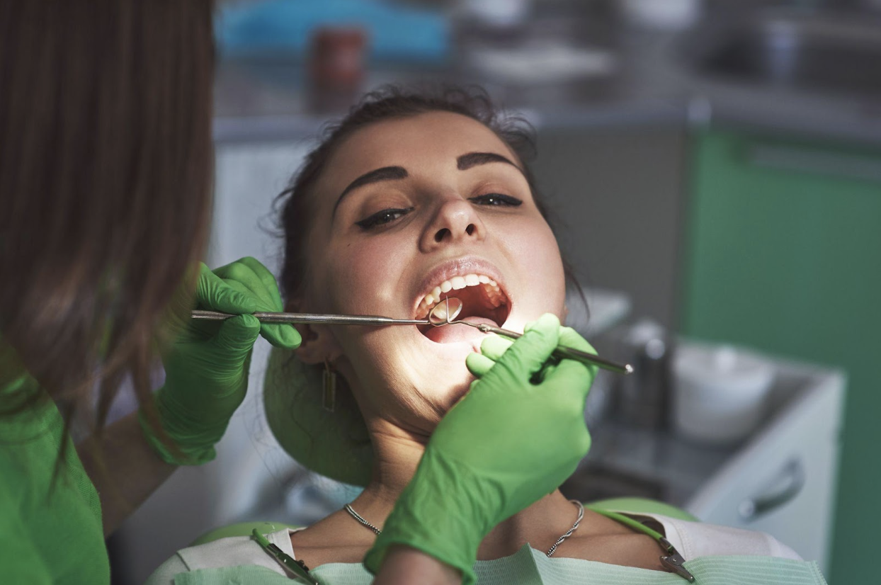 patient at the dentist undergoing dental checkup