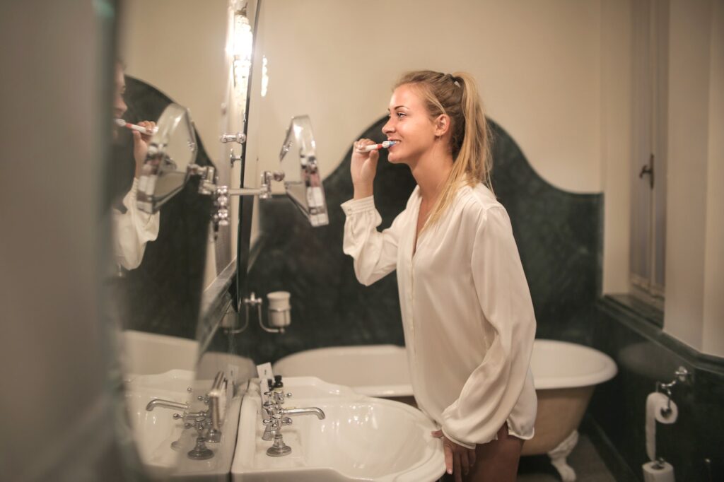 woman brushing teeth