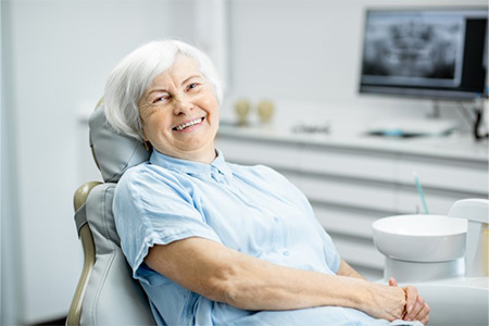 Patient smiling in the patient’s chair