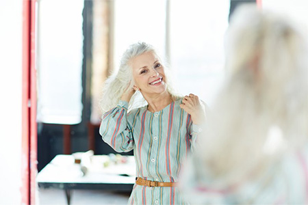 Woman smiling in the mirror