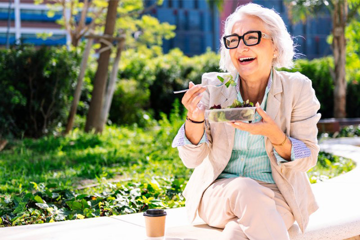Lady enjoys salad.