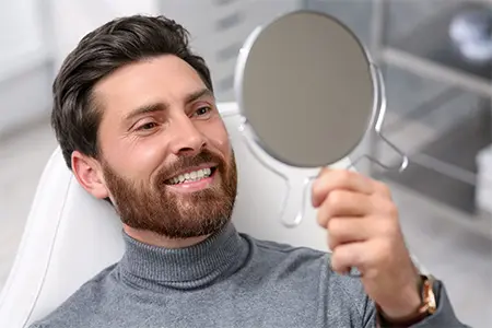 Middle-aged man visiting the dentist.